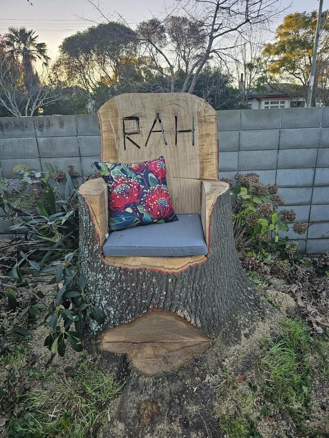 Tree stump carved into a chair by Down 2 Earth in Hawke's Bay